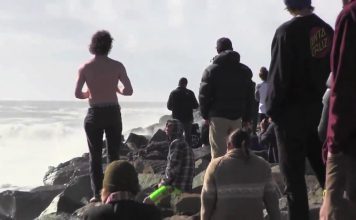 Watch these surfers ride gnarly waves at the South Mission Jetty inlet blank